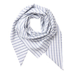 A lightweight scarf with a white base and thin vertical navy blue stripes, styled in a loose knot on a solid white background.